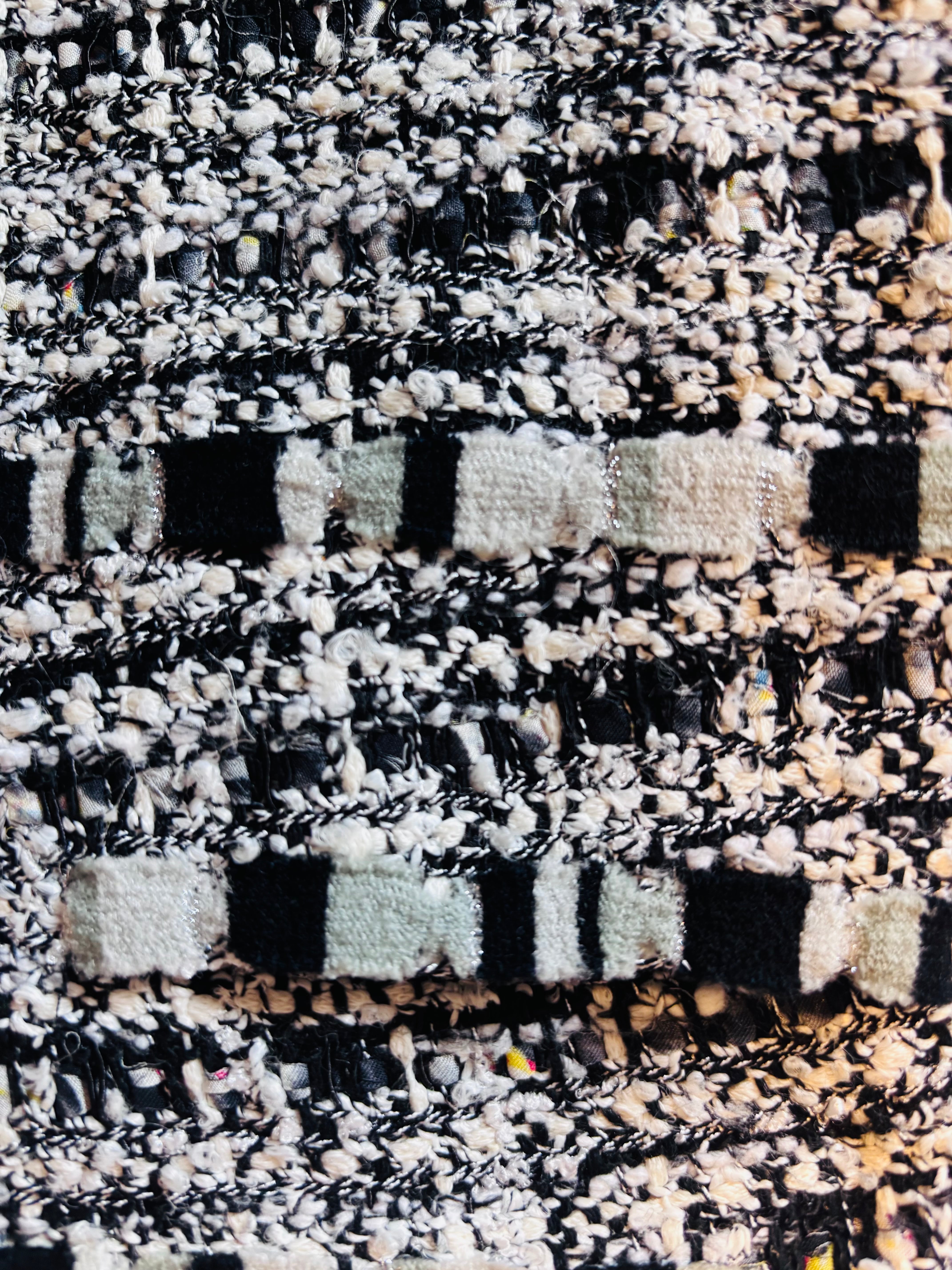 CHANEL Tweed Skirt with Silk Monogram Underskirt: Iconic.